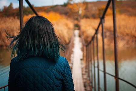 Woman standing on a bridge thumbnail