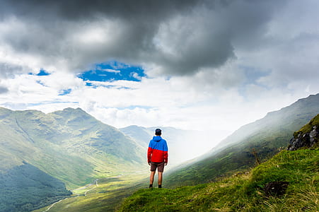 man standing near cliff thumbnail