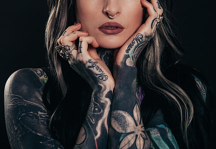 woman with black and green henna tattoos thumbnail
