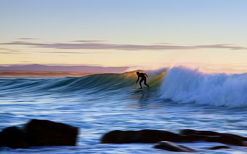 man surfing during water wave thumbnail