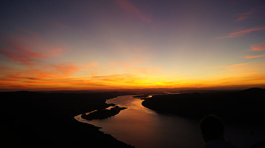 silhouette of river during golden hour thumbnail