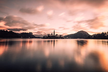 landscape photography of city near body of water thumbnail