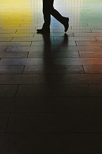 person walking on brick pavement thumbnail