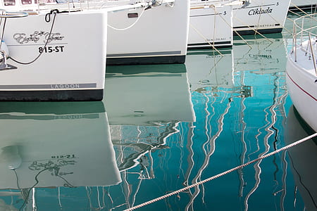 docked white boats thumbnail