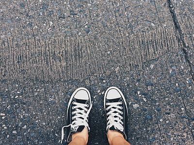 Person Wearing Pair of Black-and-white Converse All Star Low Sneakers thumbnail