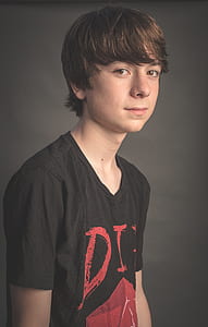 boy wearing black top photo thumbnail