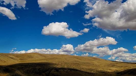 hill landscape during daytime thumbnail
