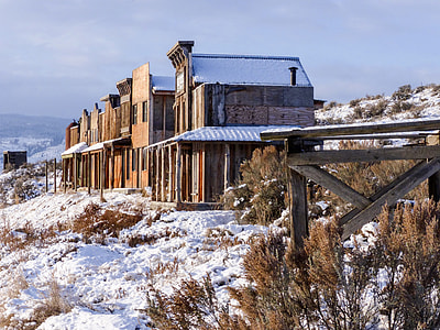 gray houses on hill covered by snow thumbnail