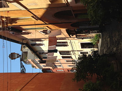 clothes hanged between buildings thumbnail