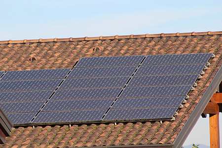brown roof shingles installed with solar panels thumbnail