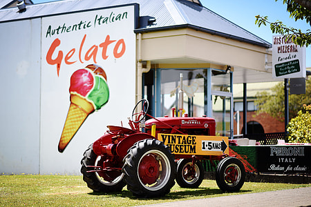 red and orange tractor during daytime thumbnail