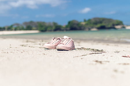 shallow focus photography of pair of pink low-top sneakers thumbnail