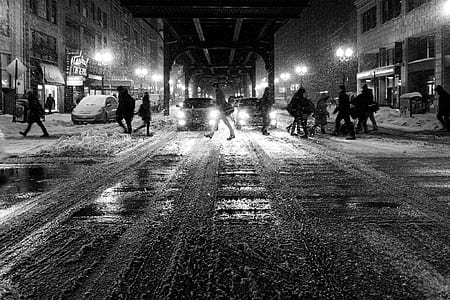 silhouette of people walking on the road during nighttime thumbnail