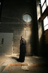 Standing Woman Wearing Black Dress in Building thumbnail
