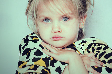 blond girl wearing white and black top thumbnail