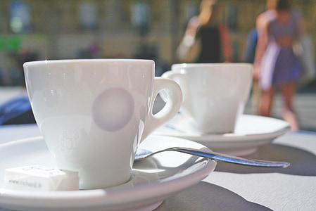 white ceramic cups and saucer on table thumbnail