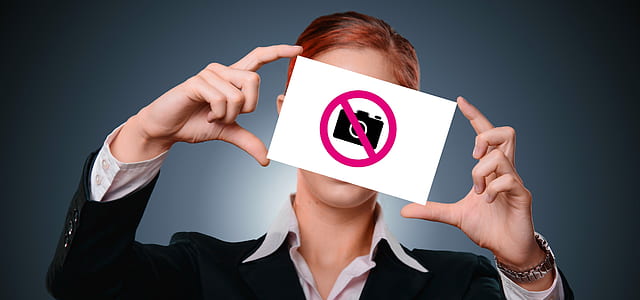woman holding no camera allowed poster thumbnail