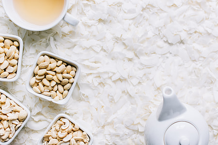 Nuts with tea on coconut flakes thumbnail