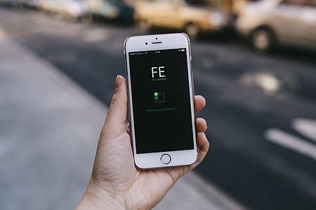 person holding turned-on iPhone thumbnail