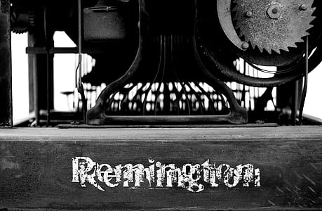 grayscale photography of Remington on wooden surface thumbnail