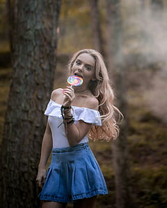 woman licking lollipop thumbnail
