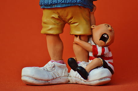 boy hugging man's foot figurine set thumbnail
