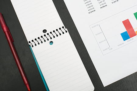 Doing Finances And Taking Notes Photo thumbnail