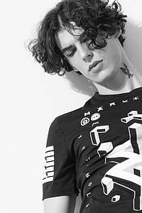gray scale photo of black and white crew-neck top thumbnail