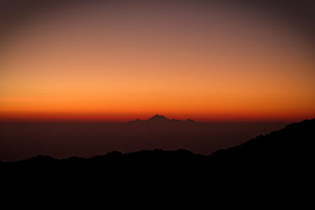 silhouette of mountain during golden hour thumbnail