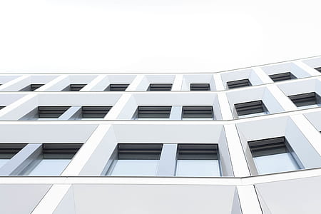 low angle photography of white concrete high rise building thumbnail