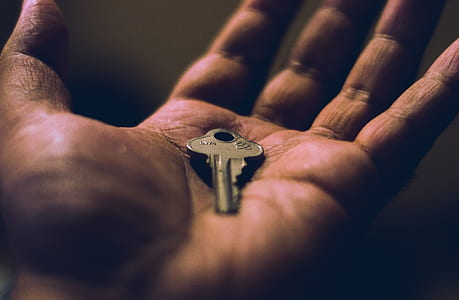 key on person's left hand thumbnail