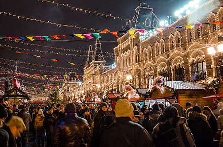 people walking and standing near lighted cathedral thumbnail