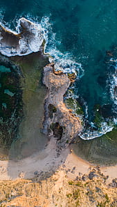 low-angle photography of beach side thumbnail