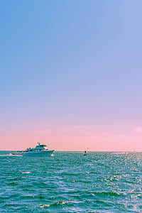 white yacht on body of water thumbnail