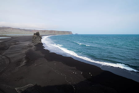 black sand near seashore thumbnail