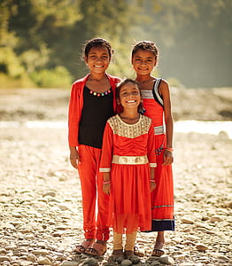 three girls wearing red dresses thumbnail