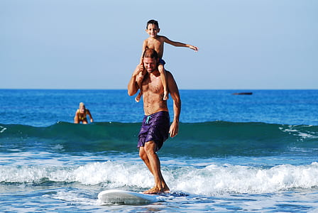 man surfing on beach thumbnail