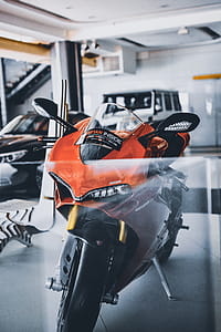 Red and Black Sports Bike Parking Inside Garage thumbnail