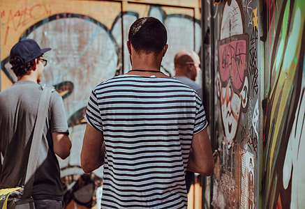 three men walking outside during daytime thumbnail