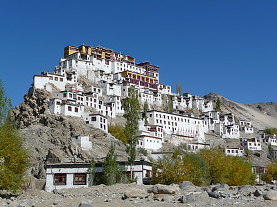 white concrete buildings on elevated mountain during daytime thumbnail