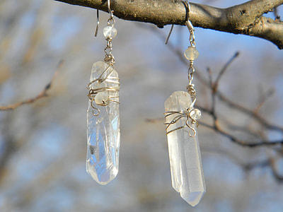 quartz crystal hook earrings attached to tree branch thumbnail