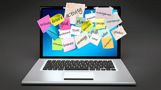 turned-on laptop computer covered with sticky notes thumbnail
