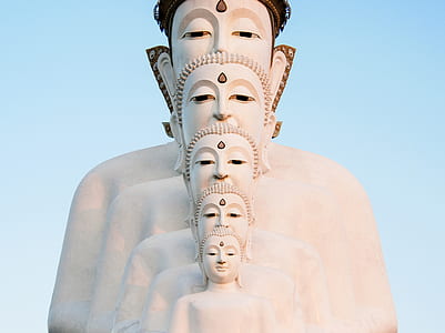 low angle photography of white Gautama Buddha figurine thumbnail