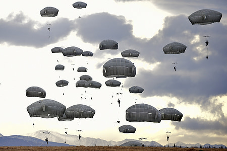 people floating using parachutes at daytime thumbnail