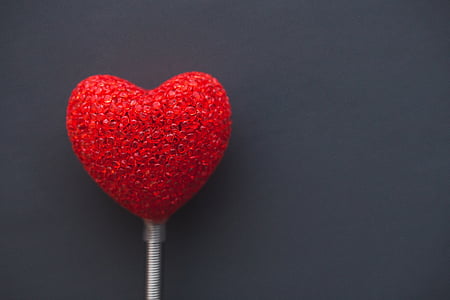 red heart party favor on top of gray surface thumbnail