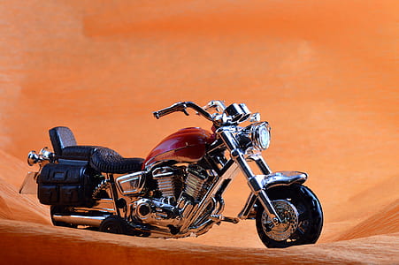 red and chrome cruiser motorcycle on desert thumbnail