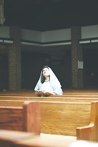 woman praying inside church thumbnail
