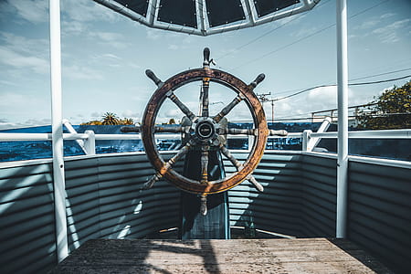 brown wooden ship's wheel thumbnail