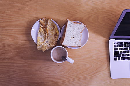 White Ceramic Mug Beside Bread on White Ceramic Saucer thumbnail