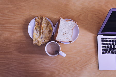 bread and roti on plate near coffee filled mug thumbnail